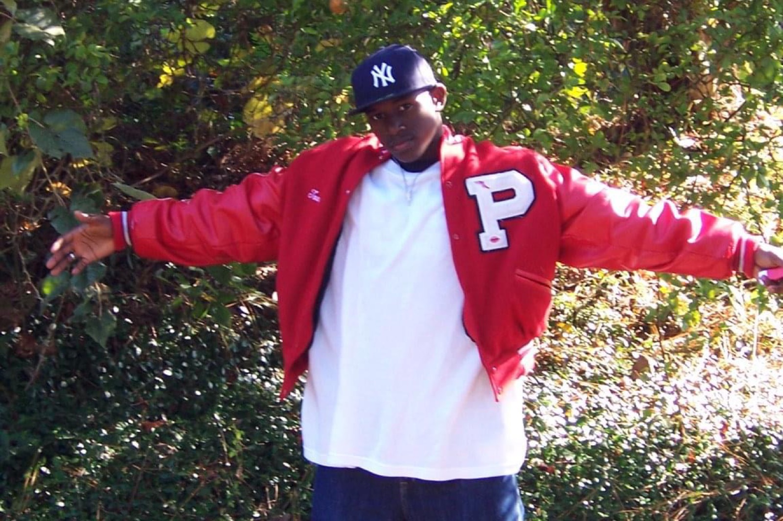 Cartez wearing a varsity jacket
